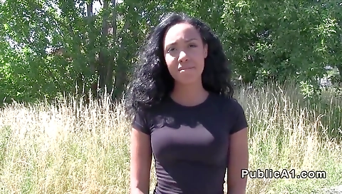 Brunette girl with big black boobies flashes her black cock