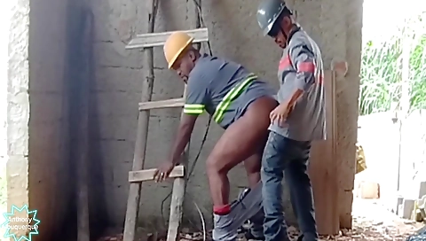 Ebony brunette plays with her black friend in a big black box