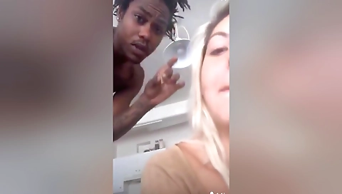 Blonde in short tight shorts shows her tattoos in porn clip